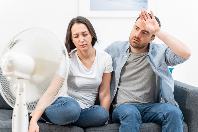 Couple struggling to stay cool due to their air filter being clogged.